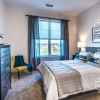 Bedroom with natural lighting and high ceilings