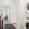 View of full size washer and dryer in hallway of apartment