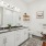 Bathroom with double vanity sinks, standing shower, large vanity mirror